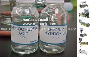 زجاجات تعبئة سوائل كيميائية معملية تعبأ بماكينة موديل 451 ماركة المهندس منسي ،ماكينات تعبئة
